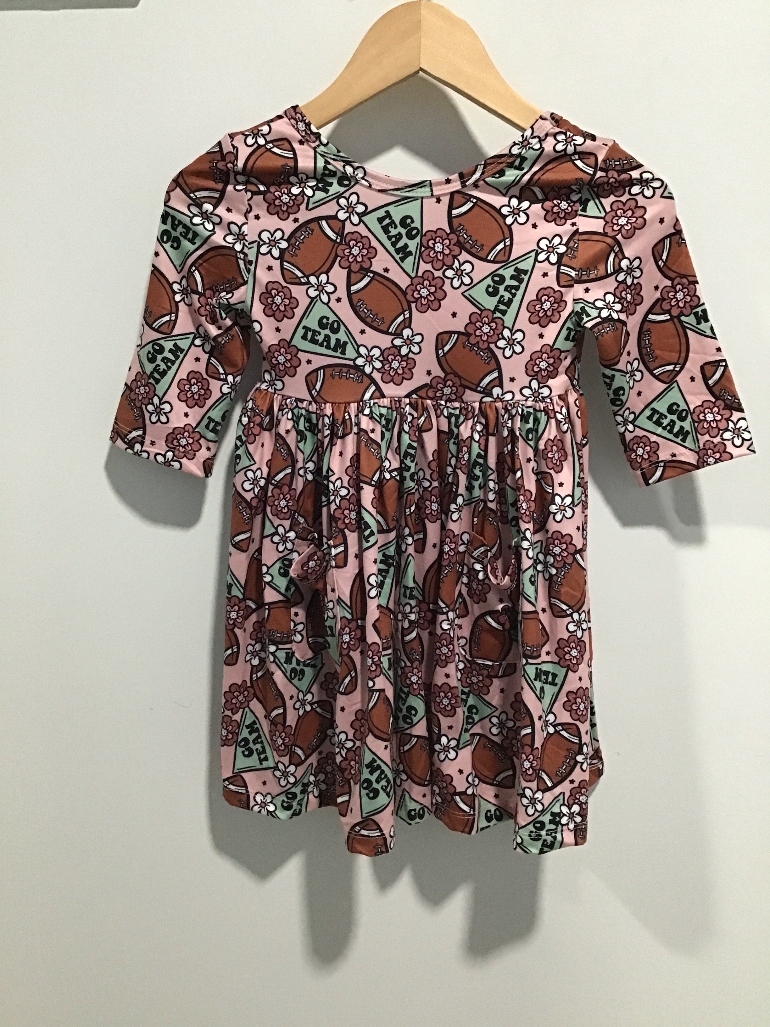 Girls’ “Go Team” Football Twirl Dress – Long Sleeve Pink Game Day Outfit with Pockets & Floral Print