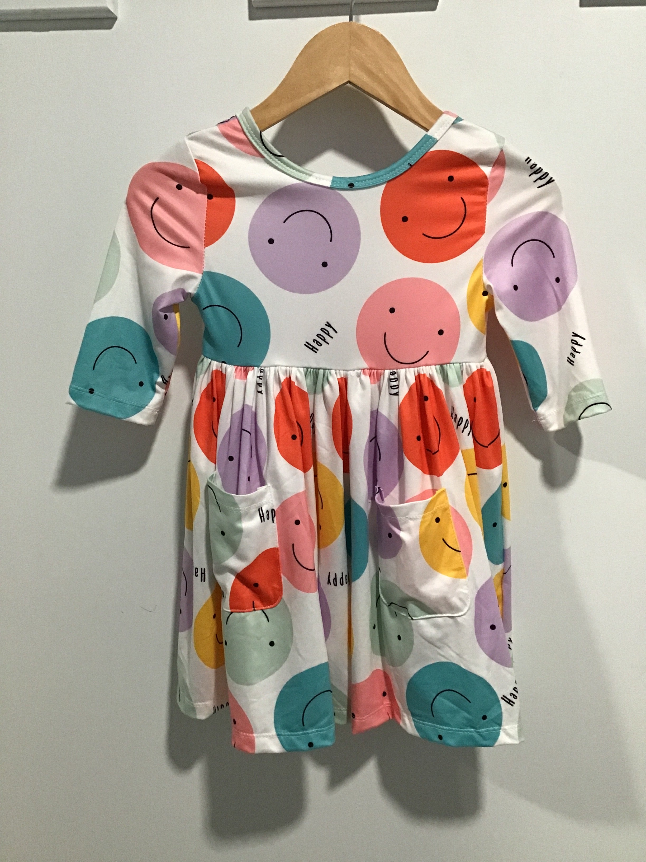 Happy Days Smiley Face Twirl Dress – Girls’ 3/4 Sleeve Pocket Dress with Colorful Print & Flared Skirt