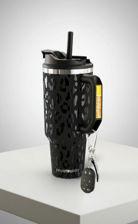 Black leopard print tumbler with handle and keychain on a white surface