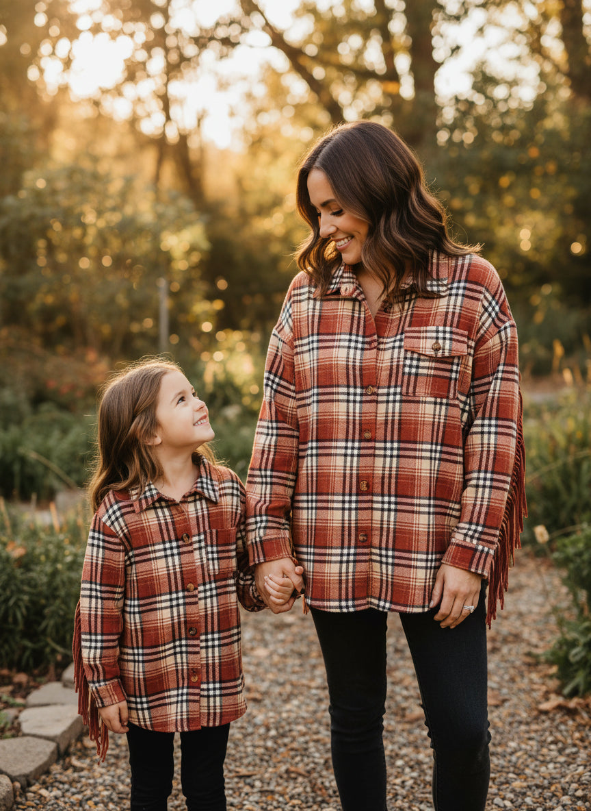 Plaid shirt with fringes on a beige background