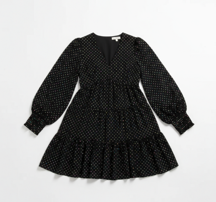 Black polka dot dress with long sleeves on a white background