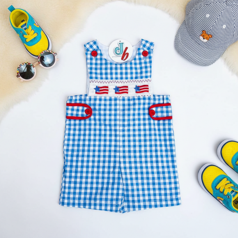 Boys Patriotic Smocked Romper – Blue Gingham One-Piece with American Flag Embroidery & Red Button Accents
