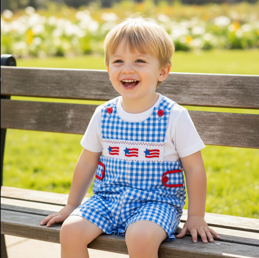 Boys Patriotic Smocked Romper – Blue Gingham One-Piece with American Flag Embroidery & Red Button Accents