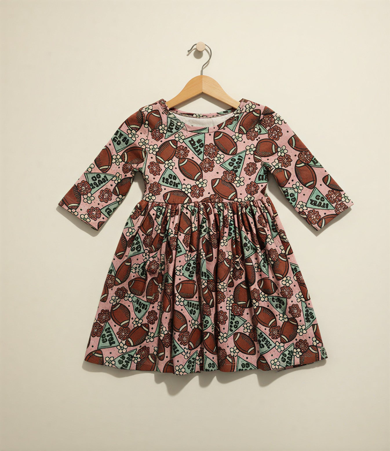 Girls’ “Go Team” Football Twirl Dress – Long Sleeve Pink Game Day Outfit with Pockets & Floral Print