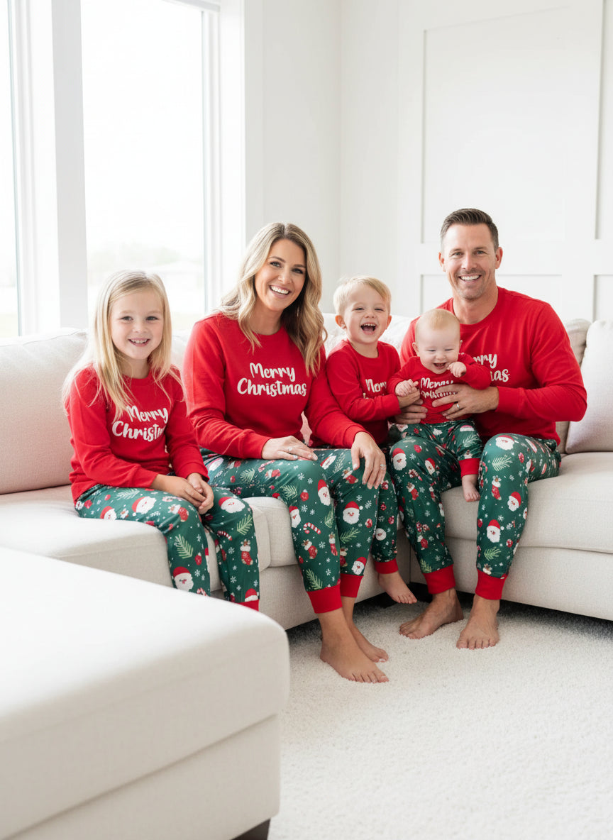 Child wearing a red 'Merry Christmas' shirt and green patterned pants on a white background