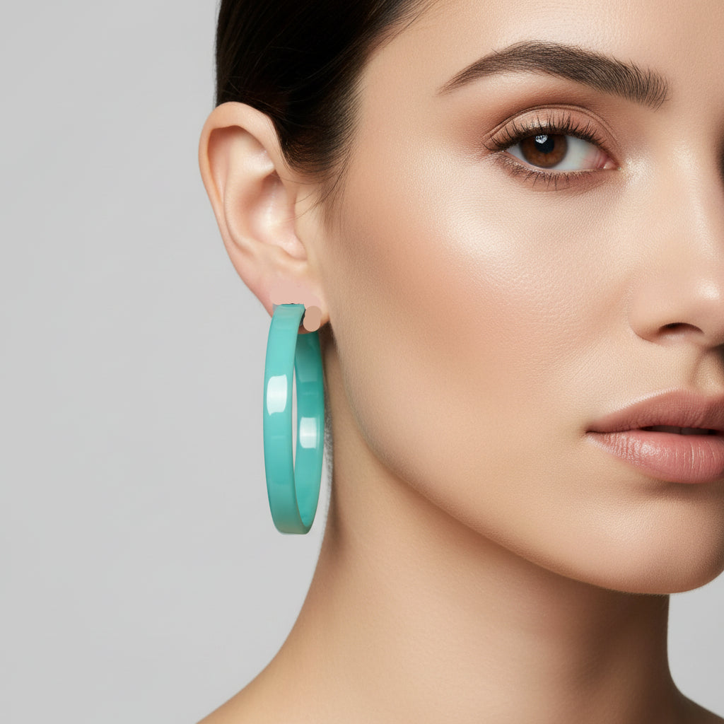 Turquoise hoop earrings on a display card with 'LINNY CO' branding.