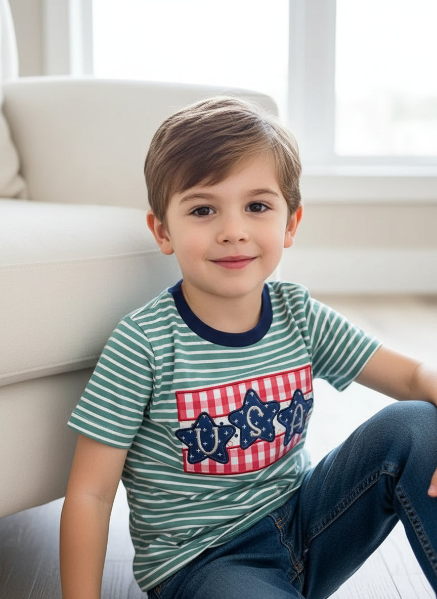 Teal and white striped t-shirt with red and white checkered star design on a fluffy white surface.